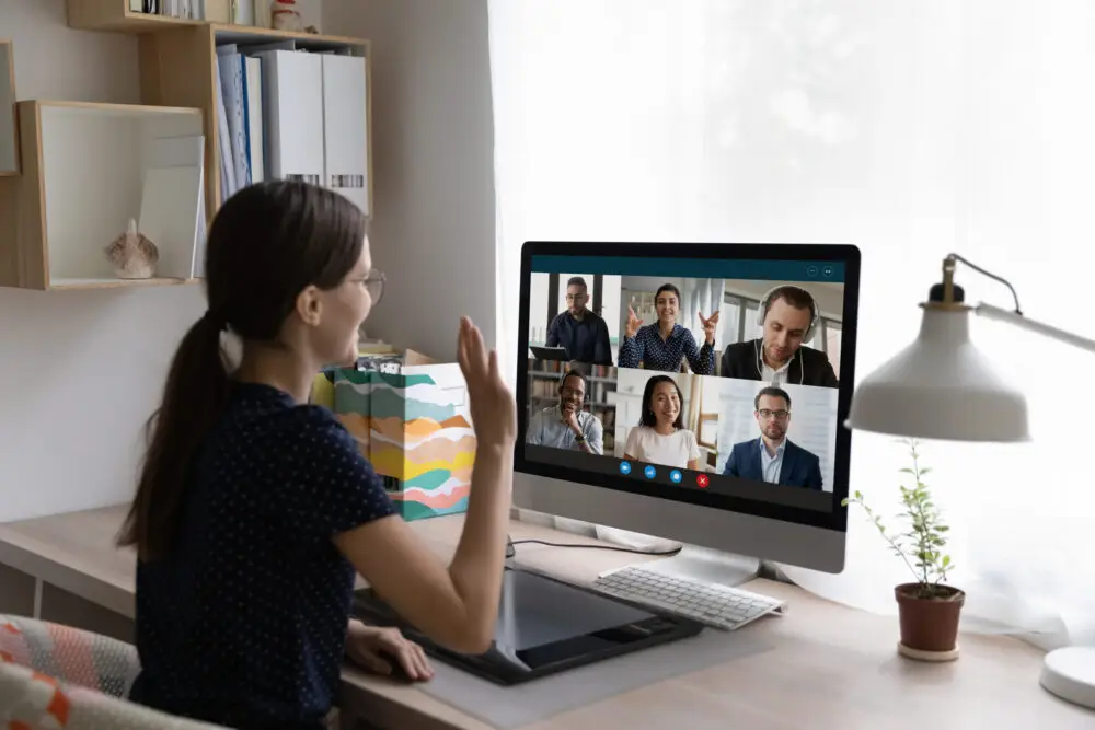 Woman greeting diverse friends, start group video call