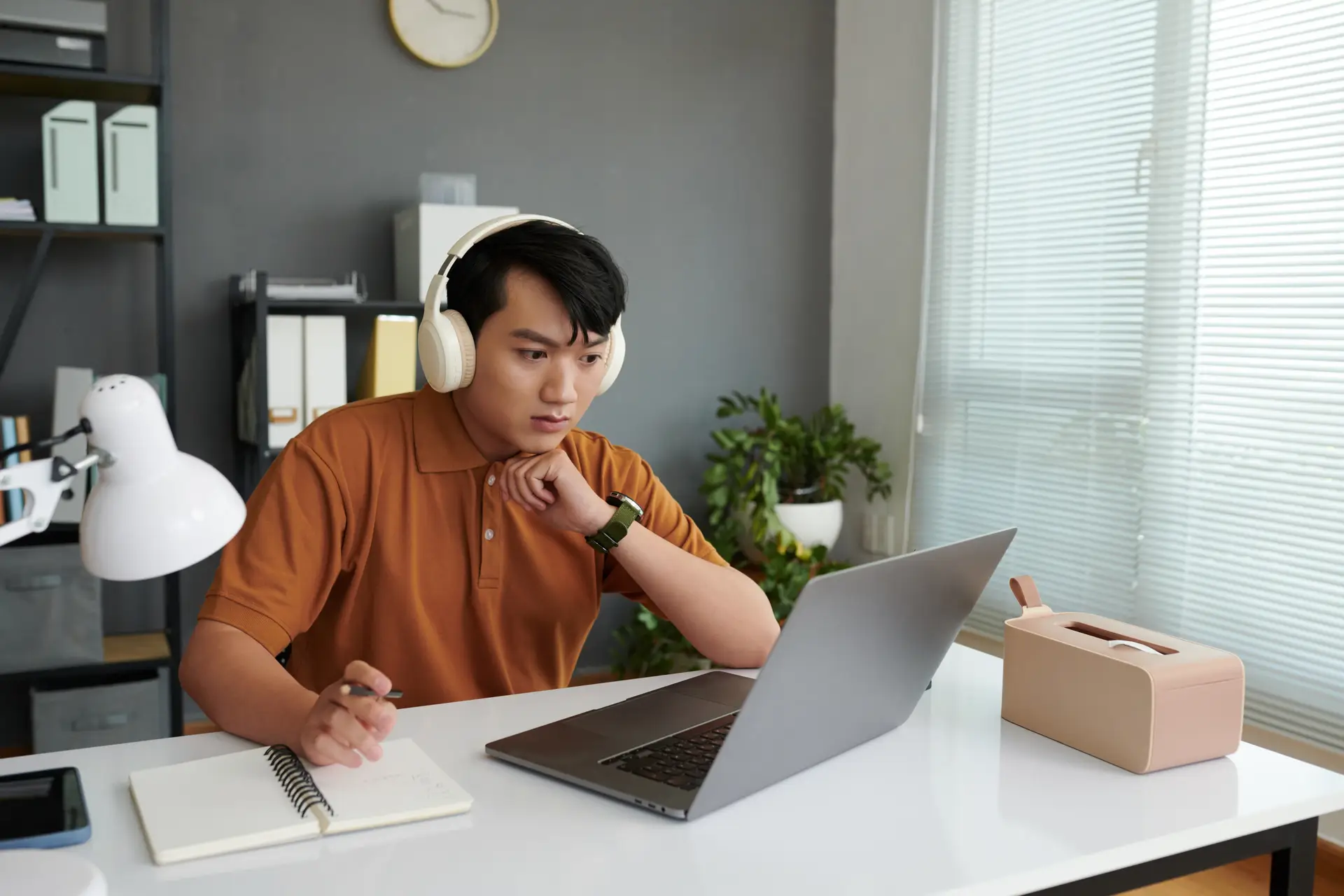 Confused Student Looking at Laptop
