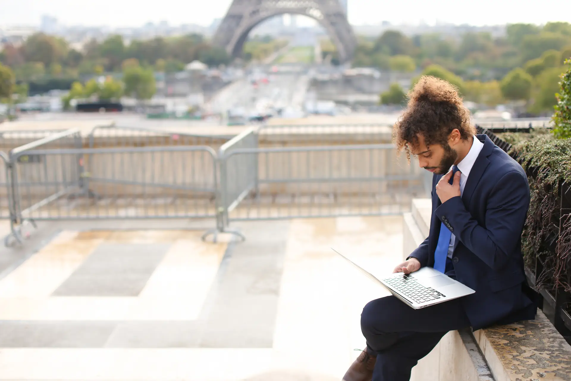 a french man outside near the eiffel tower