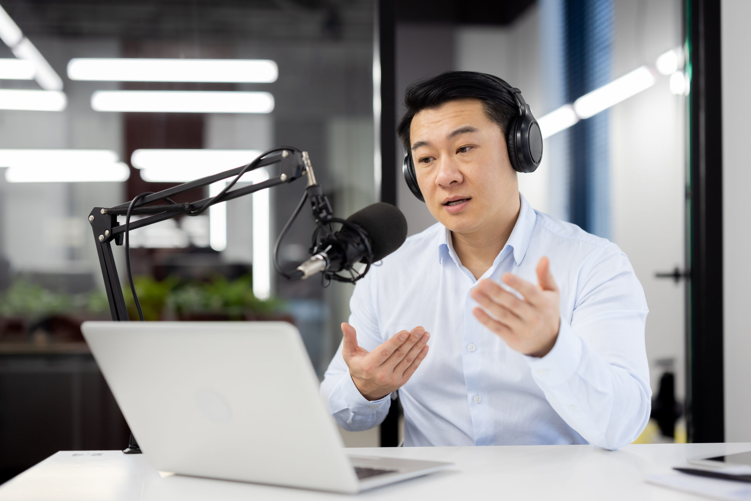Professional asian male podcaster