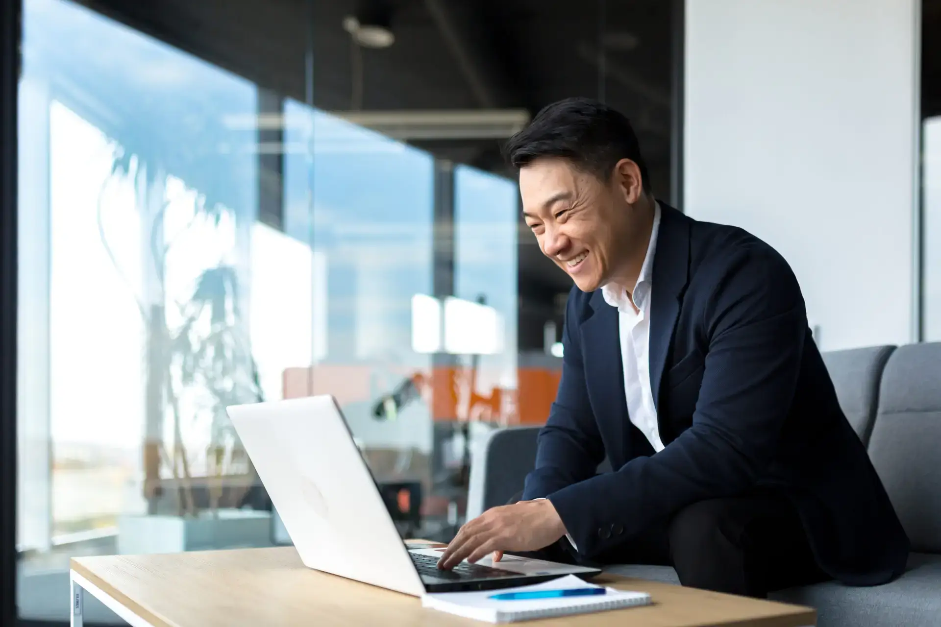 Asian Business Man on Laptop