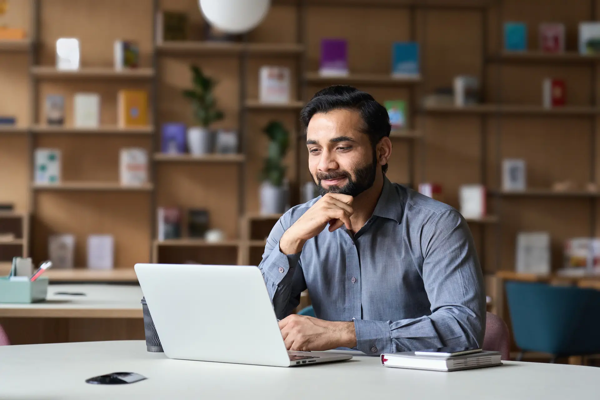 Smiling bearded indian businessman