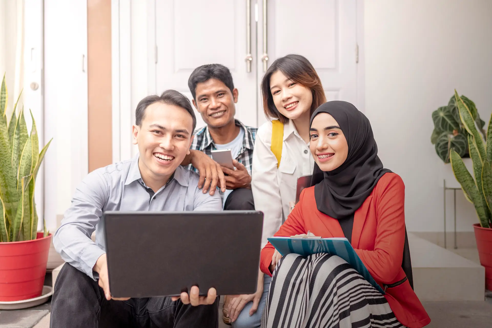 Portrait of multiethnic business colleagues discussing a business project plan during a meeting