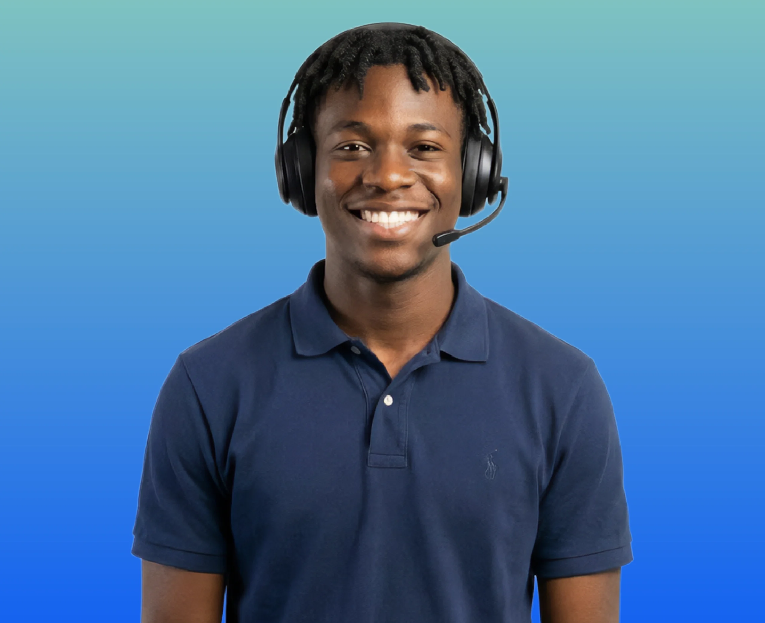 Haitian interpreter with headset on smiling at the camera