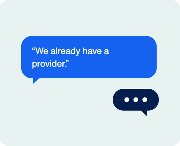 Speech bubble illustration of the sales objection "We already have a provider," with a second bubble showing a reply in progress.